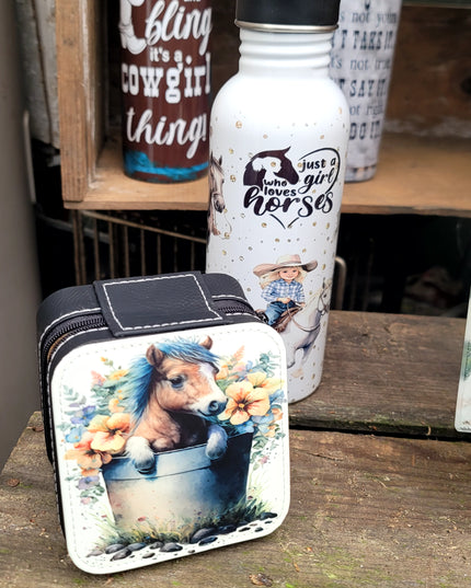 Pony in a water bucket