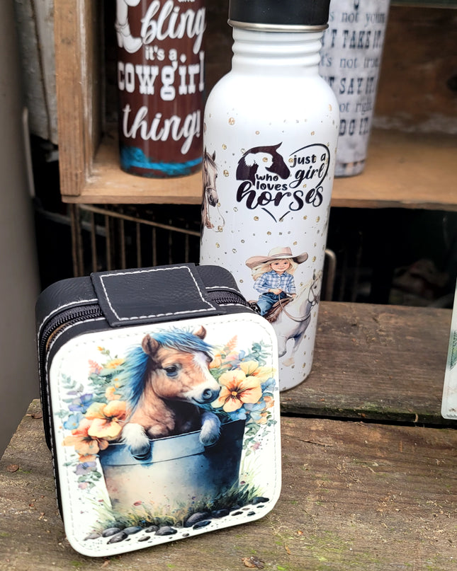 Pony in a water bucket