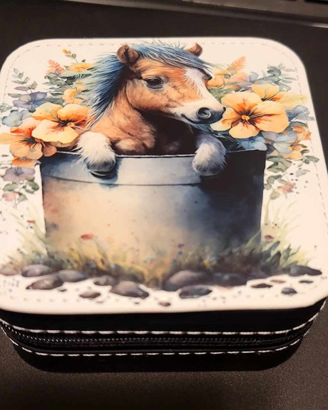 Pony in a water bucket